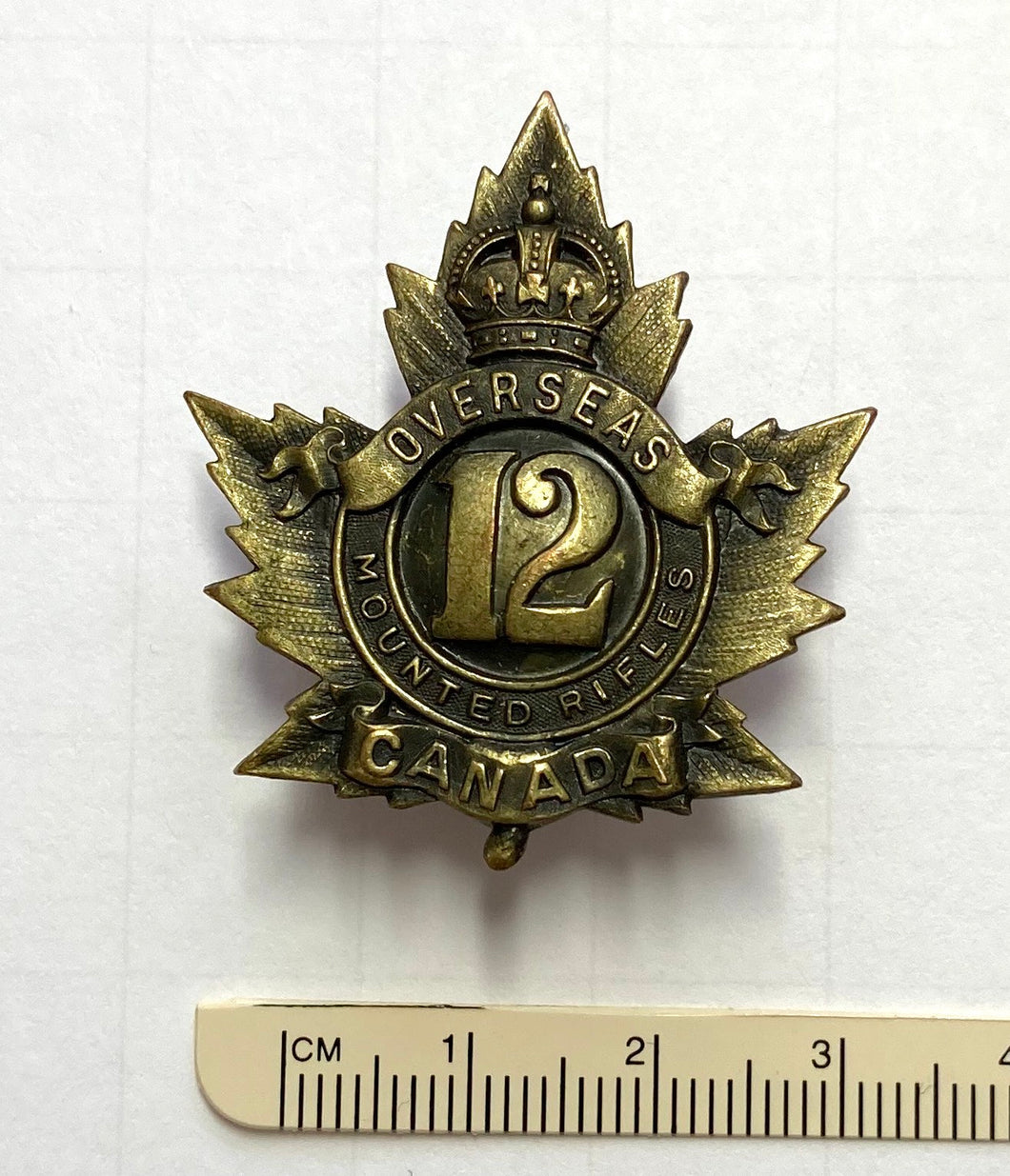 12 Canadian Mounted Rifles cap badge